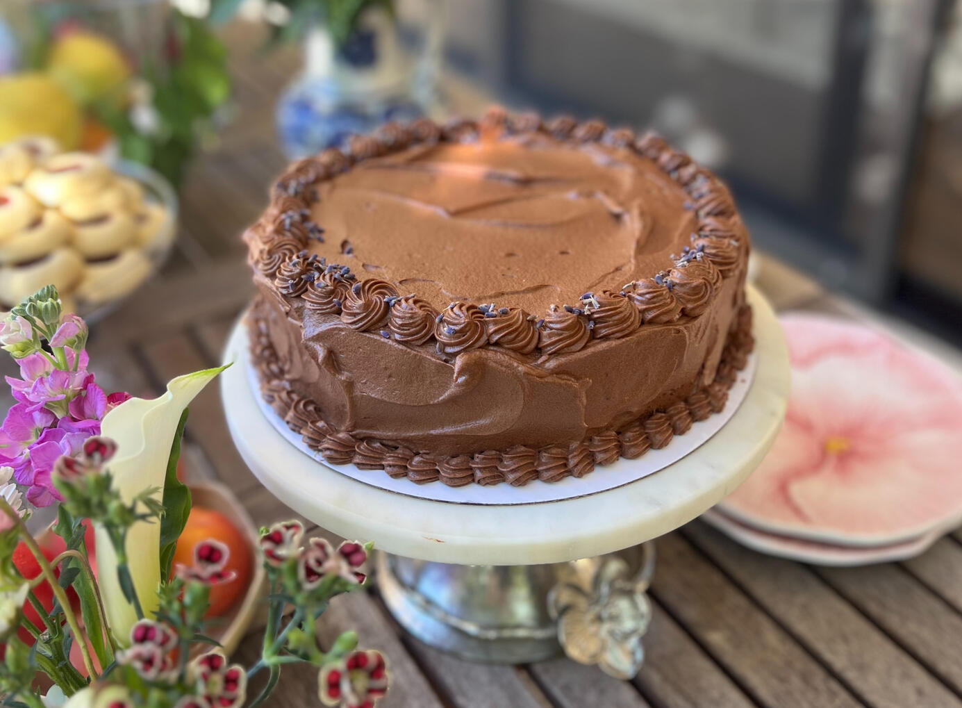 Classic Chocolate Cake Chocolate sponge cake soaked with espresso syrup and filled with a chocolate whipped cream.