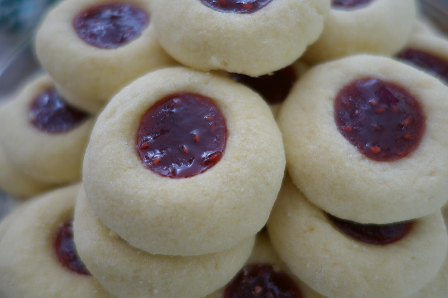 Raspberry Thumbprint Cookies Buttery thumbprint cookies filled with raspberry jam.