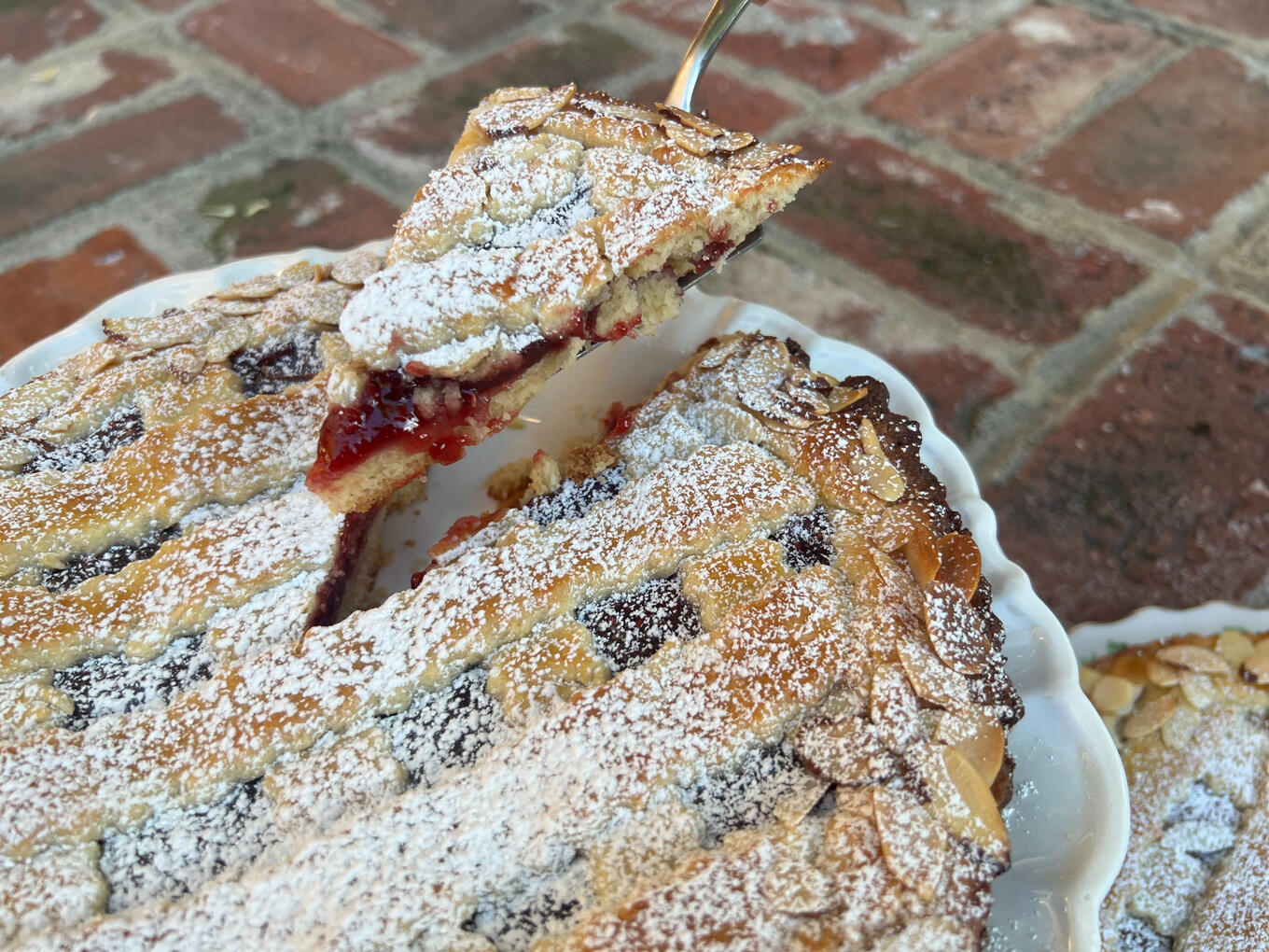 Raspberry Almond Jam Tarts Almond tart crust filled with raspberry jam and sprinkled with sliced almonds